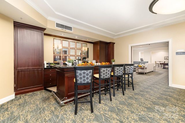 a living room with furniture a window and chairs