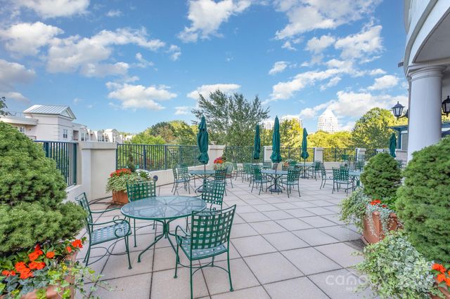 a view of yard with furniture and outdoor seating