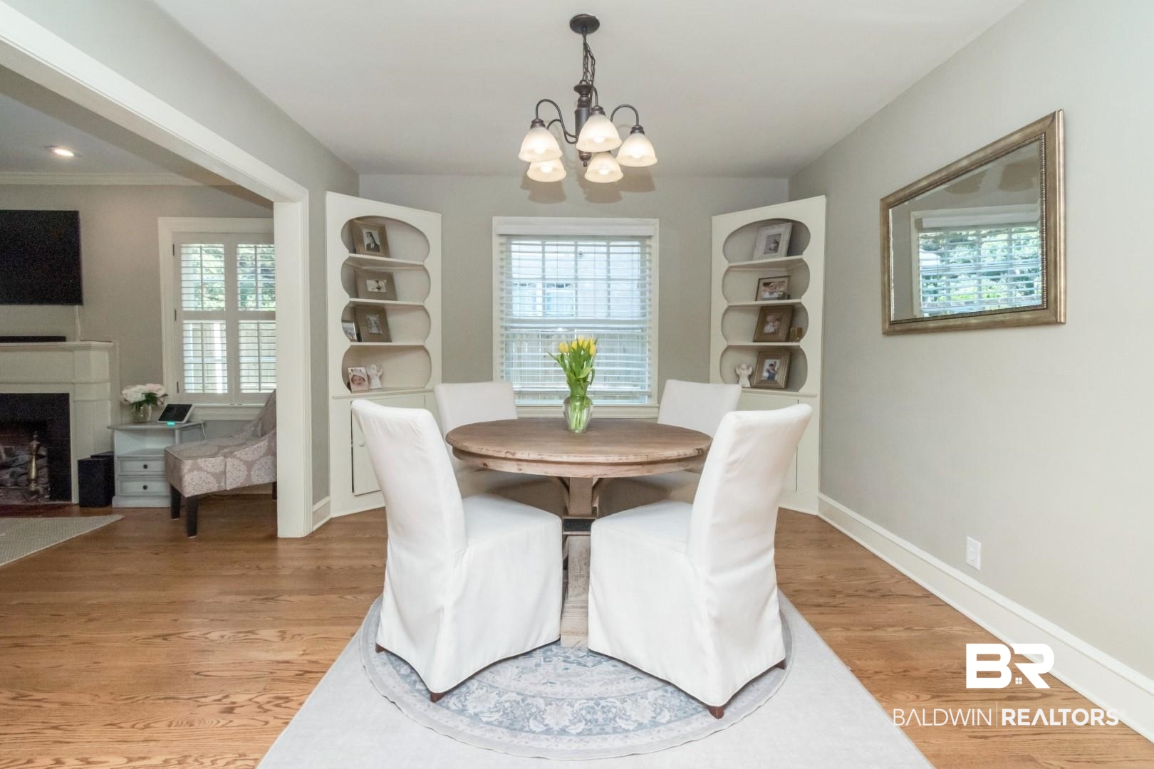 116 Florence Place Mobile, AL 36607 - Photo 8 of 41 Dining area with wood-type flooring, a notable chandelier, and a wealth of natural light