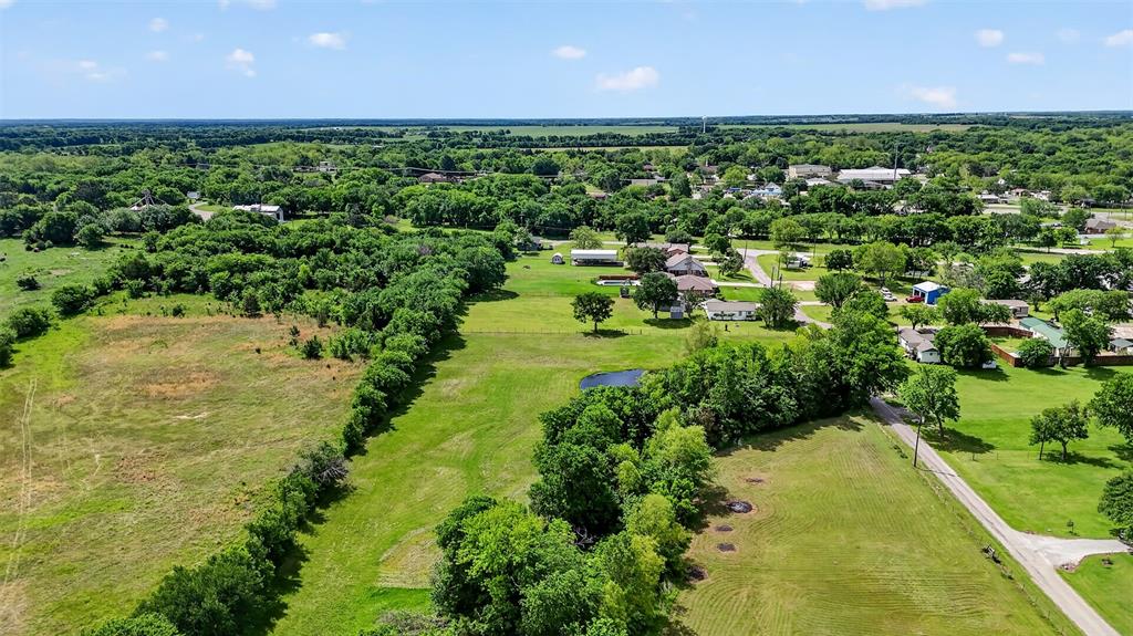 Tbd Pecan Street Ector, TX 75439 - Photo 11 of 18 a view of a yard with plants and a garden