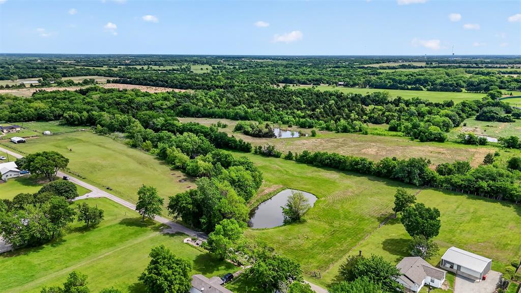 Tbd Pecan Street Ector, TX 75439 - Photo 4 of 18 an aerial view of a golf course with a lake view