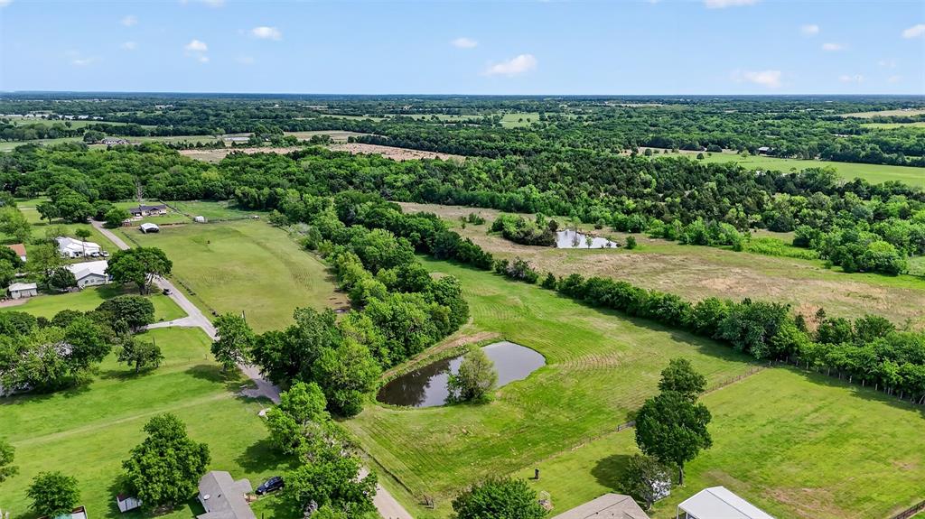 Tbd Pecan Street Ector, TX 75439 - Photo 5 of 18 a view of a lake with a garden