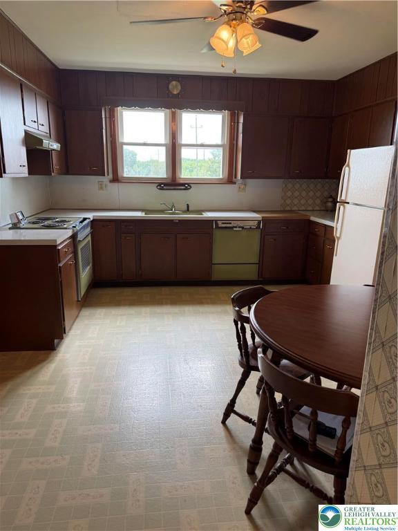 562 Georgetown Road Nazareth, PA 18064 - Photo 7 of 30 a kitchen with a table chairs a sink dishwasher window and cabinets