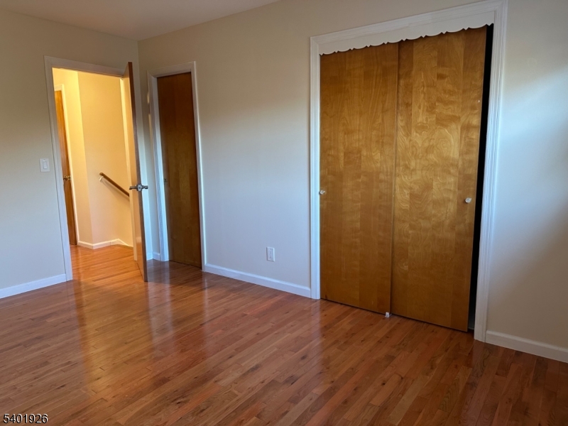 244 Olivia Street Ridgewood, NJ 07450 - Photo 15 of 43 an empty room with wooden floor and a window