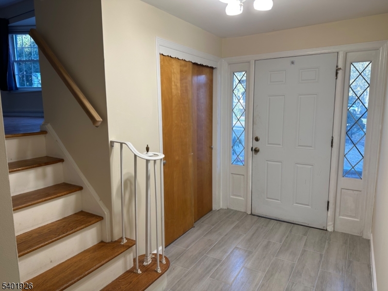 244 Olivia Street Ridgewood, NJ 07450 - Photo 2 of 43 wooden floor in an empty room with a staircase