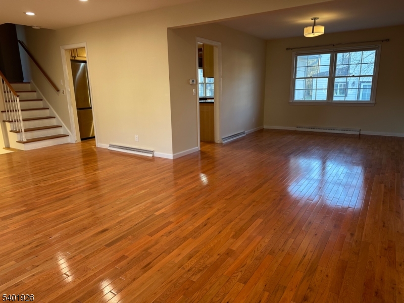 244 Olivia Street Ridgewood, NJ 07450 - Photo 4 of 43 wooden floor in an empty room with a window