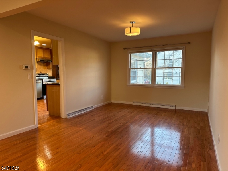244 Olivia Street Ridgewood, NJ 07450 - Photo 7 of 43 wooden floor in an empty room with a window
