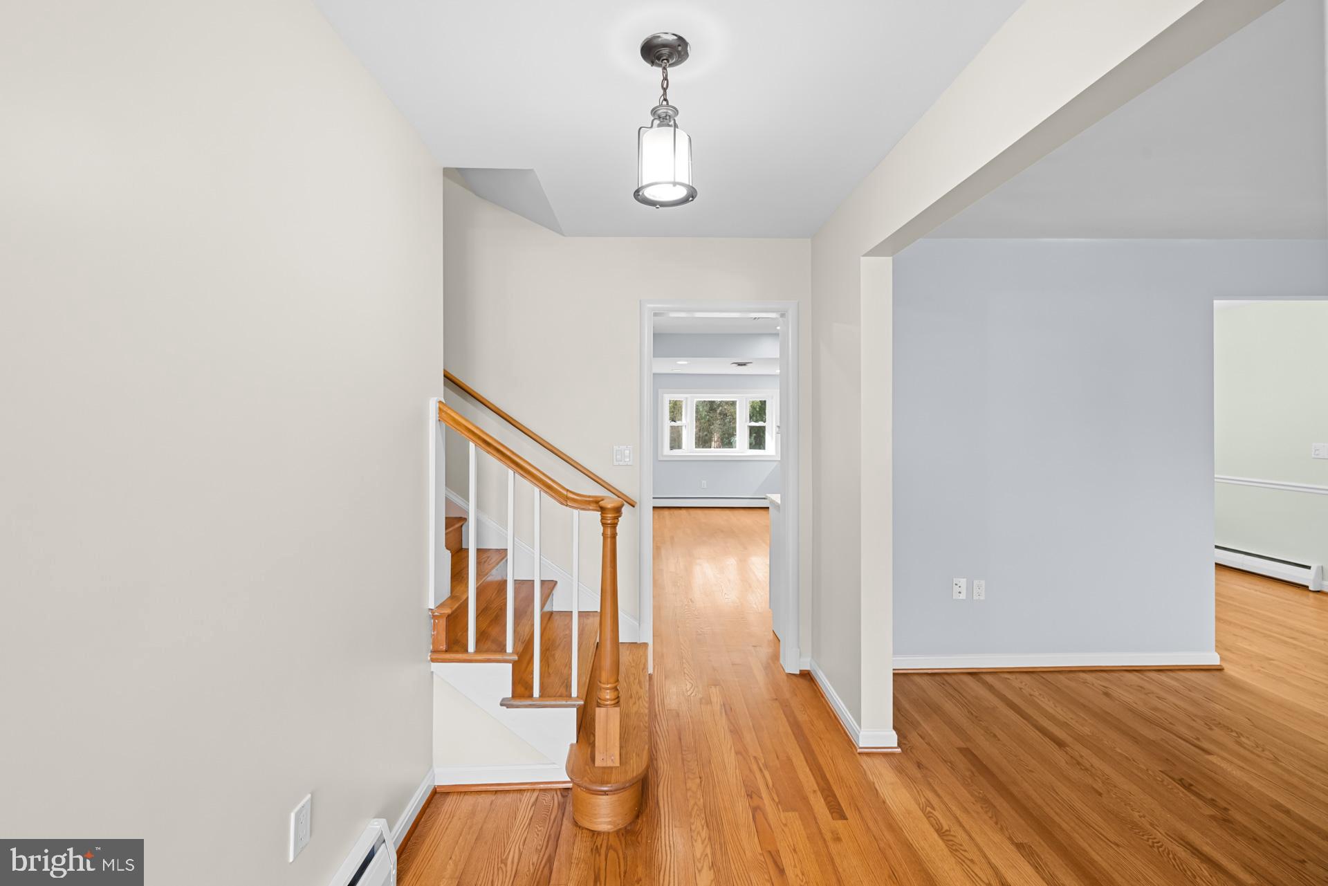 807 Winhall Way Silver Spring, MD 20904 - Photo 17 of 82 a view of a hallway with wooden floor and staircase