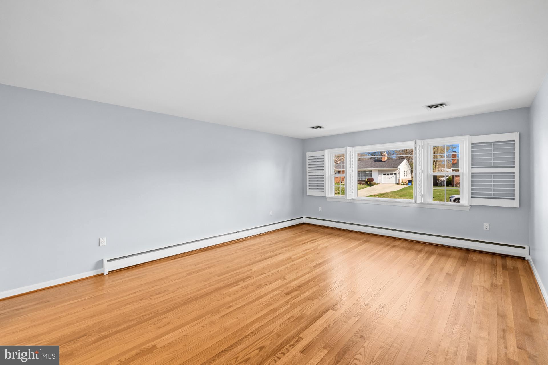 807 Winhall Way Silver Spring, MD 20904 - Photo 18 of 82 a view of a room with wooden floor and window