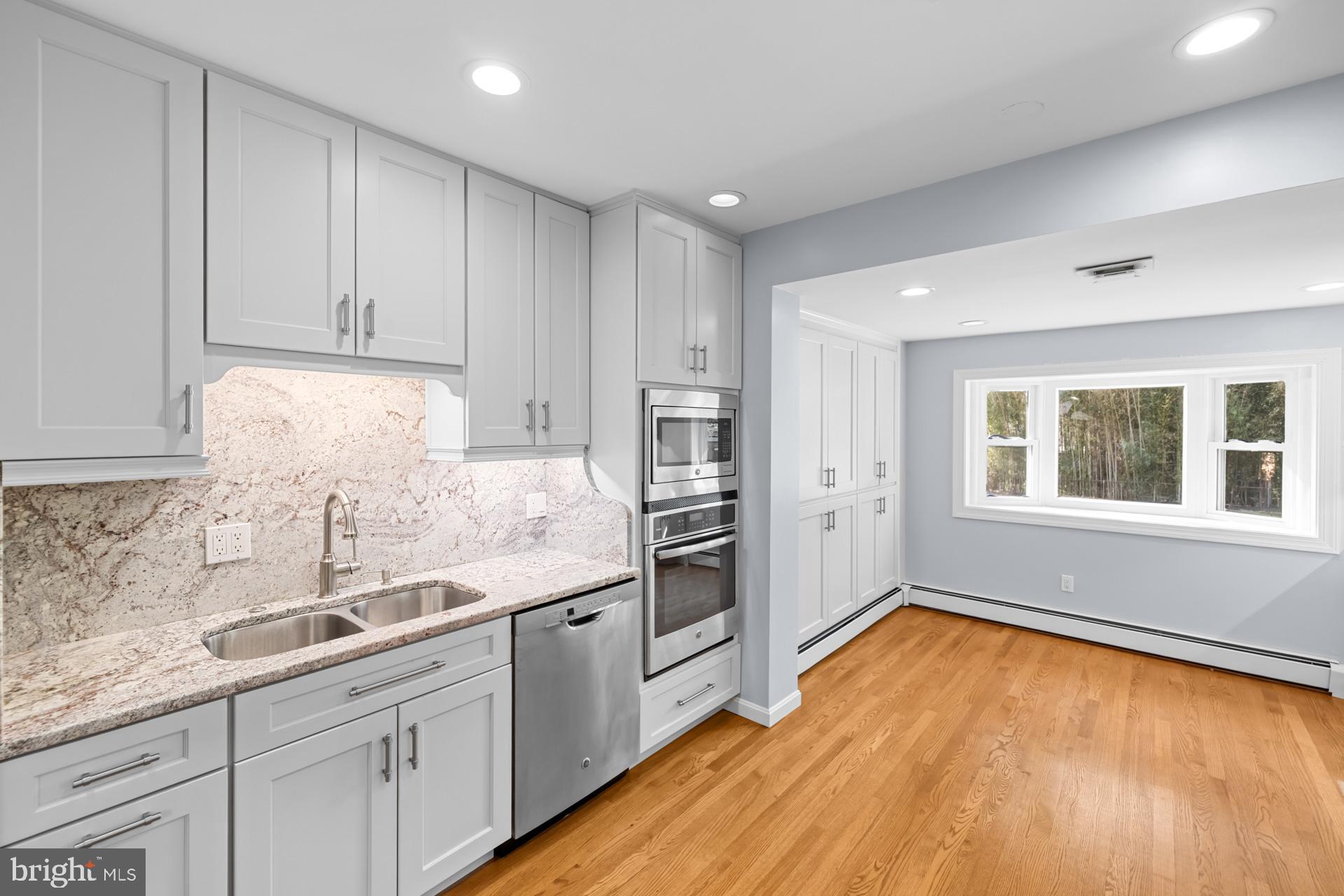 807 Winhall Way Silver Spring, MD 20904 - Photo 32 of 82 a kitchen with a sink and refrigerator