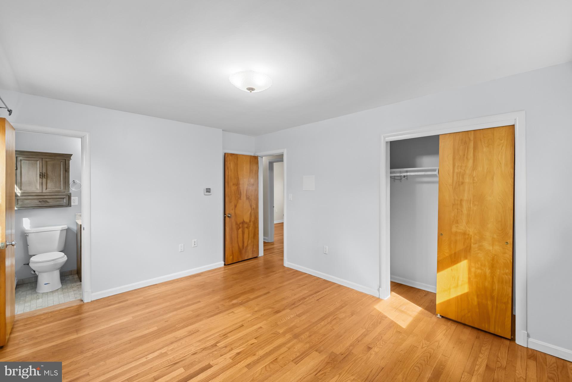 807 Winhall Way Silver Spring, MD 20904 - Photo 42 of 82 a view of a room with wooden floor and a bathroom