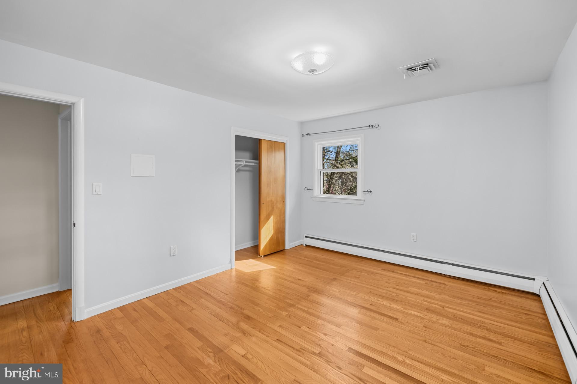 807 Winhall Way Silver Spring, MD 20904 - Photo 43 of 82 a view of an empty room with wooden floor