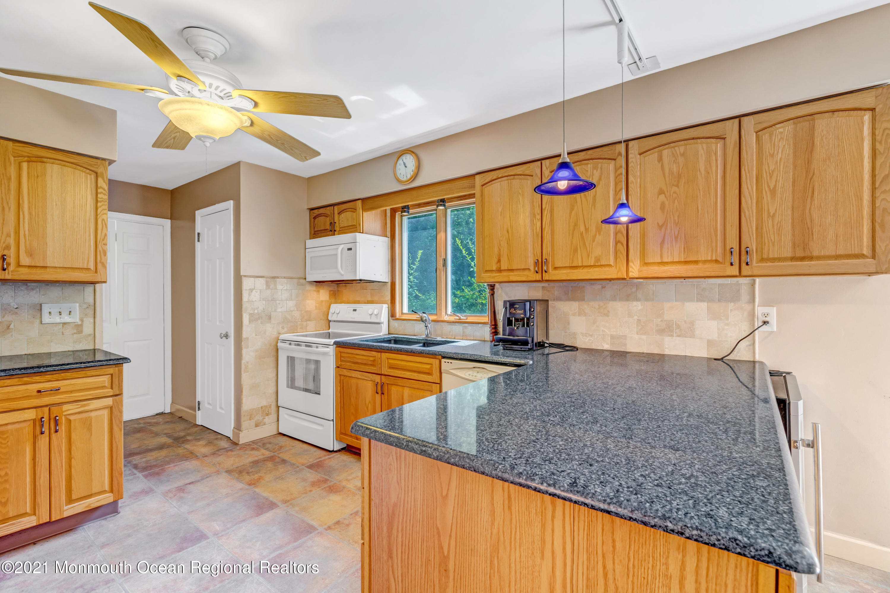 367 East Pleasant Grove Road Jackson, NJ 08527 - Photo 14 of 45 a kitchen with stainless steel appliances granite countertop a sink window and cabinets