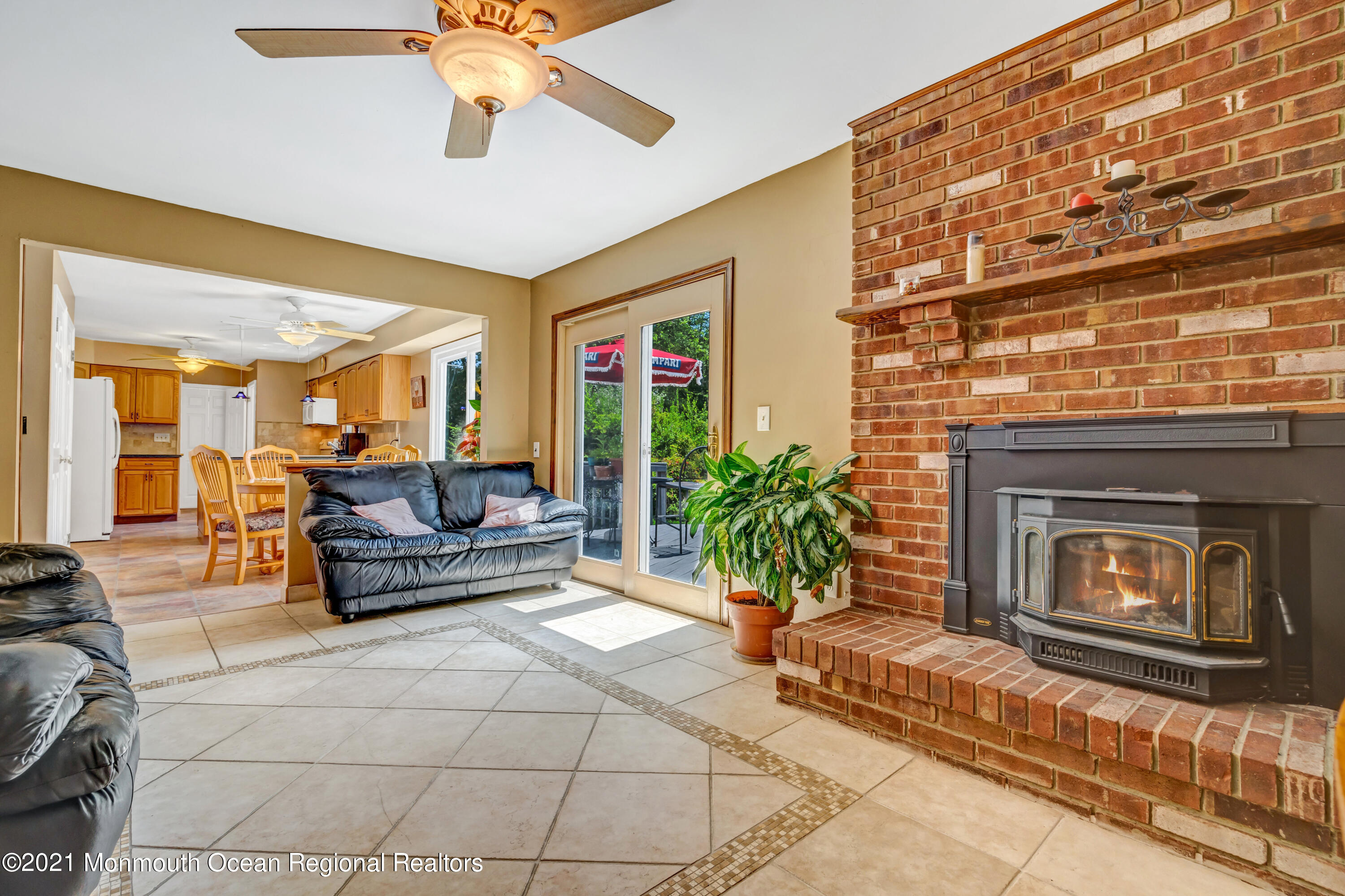 367 East Pleasant Grove Road Jackson, NJ 08527 - Photo 22 of 45 a living room with furniture and a fireplace