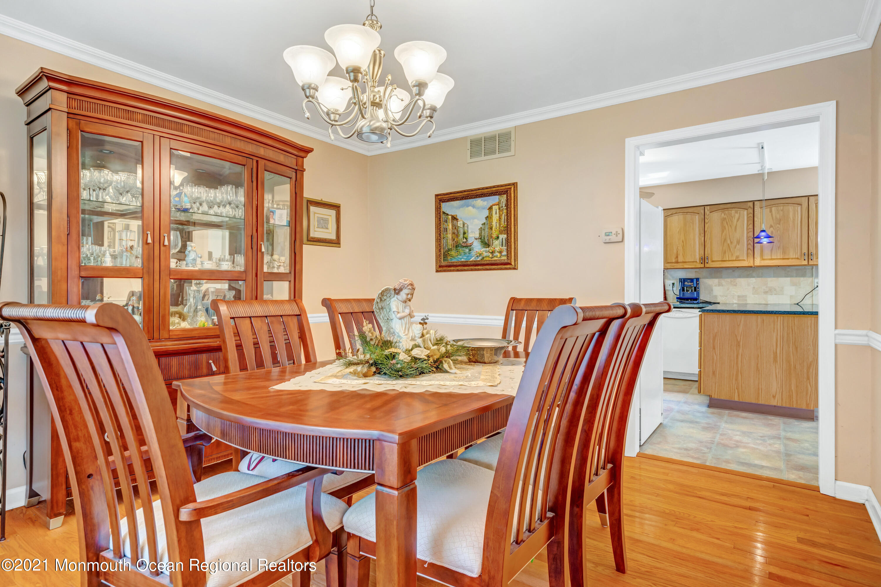 367 East Pleasant Grove Road Jackson, NJ 08527 - Photo 8 of 45 a view of a dining room with furniture wooden floor and chandelier