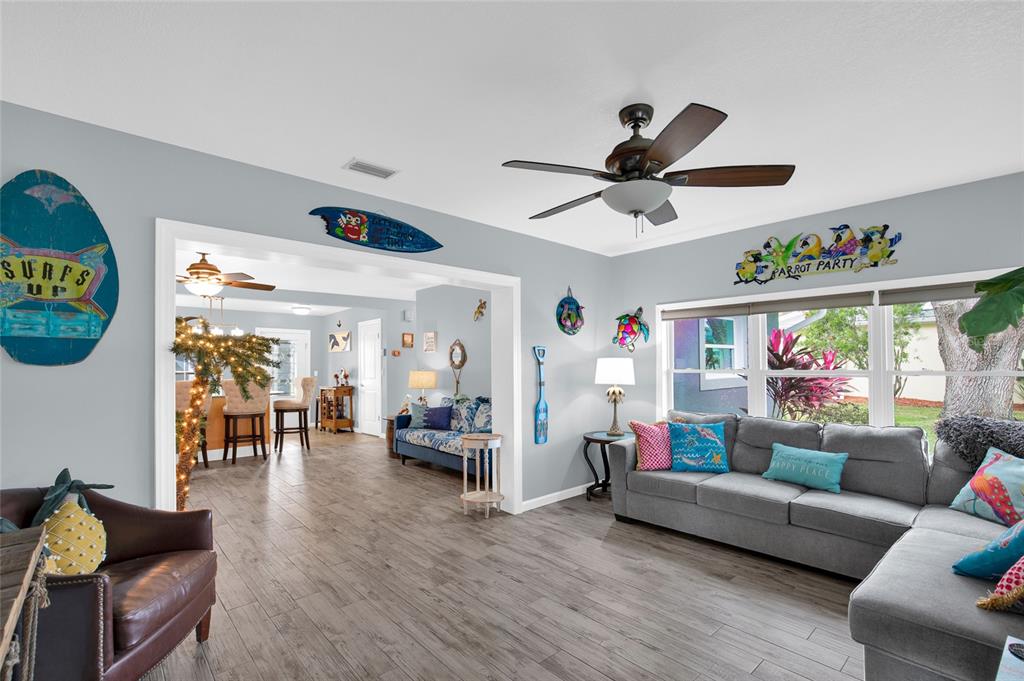 4121 South Roosevelt Point Homosassa, FL 34448 - Photo 11 of 47 a living room with furniture and a large window