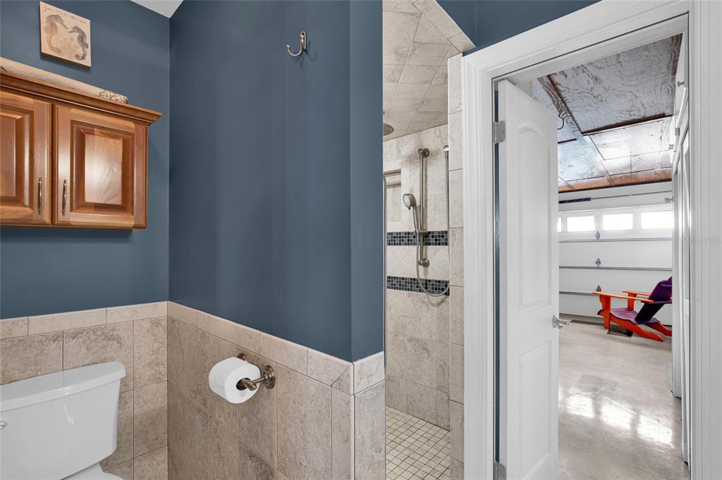 4121 South Roosevelt Point Homosassa, FL 34448 - Photo 22 of 47 a bathroom with a tub and shower