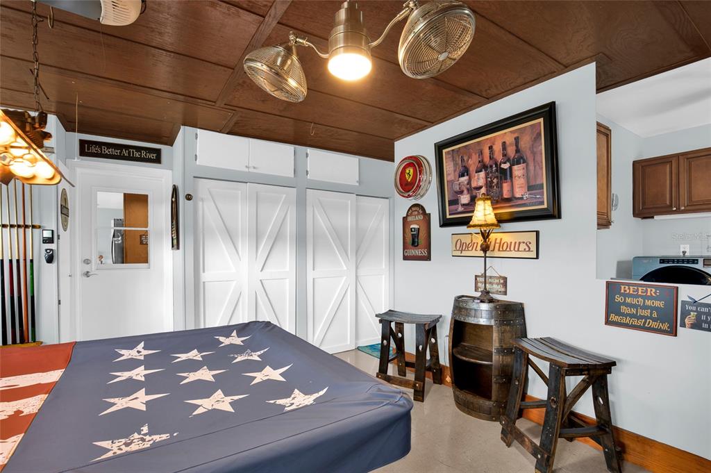 4121 South Roosevelt Point Homosassa, FL 34448 - Photo 23 of 47 a bedroom with a bed and a table