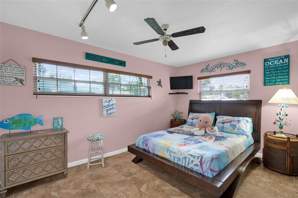 4121 South Roosevelt Point Homosassa, FL 34448 - Photo 30 of 47 a bedroom with a bed a window and dresser