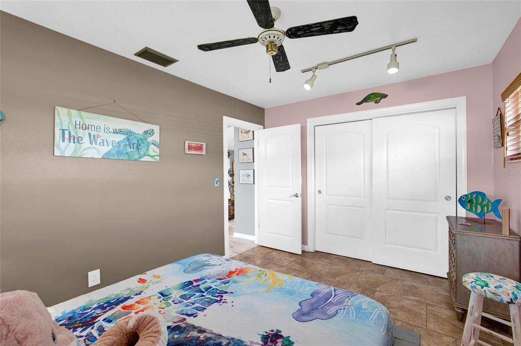 4121 South Roosevelt Point Homosassa, FL 34448 - Photo 31 of 47 a bedroom with a bed and hallway