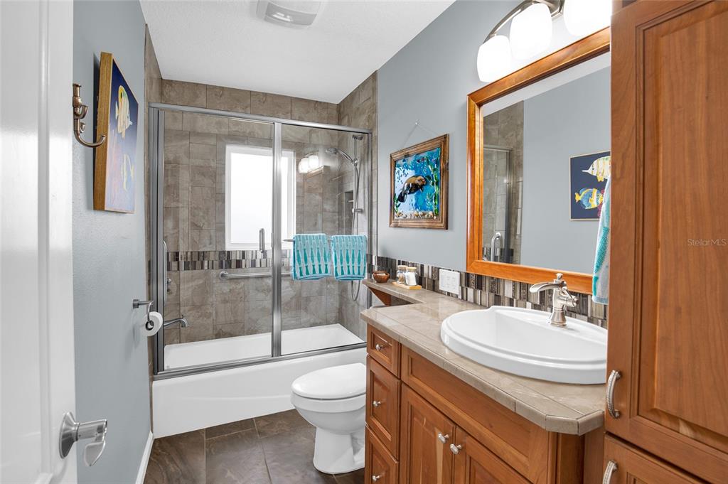 4121 South Roosevelt Point Homosassa, FL 34448 - Photo 32 of 47 a bathroom with a sink a toilet and shower