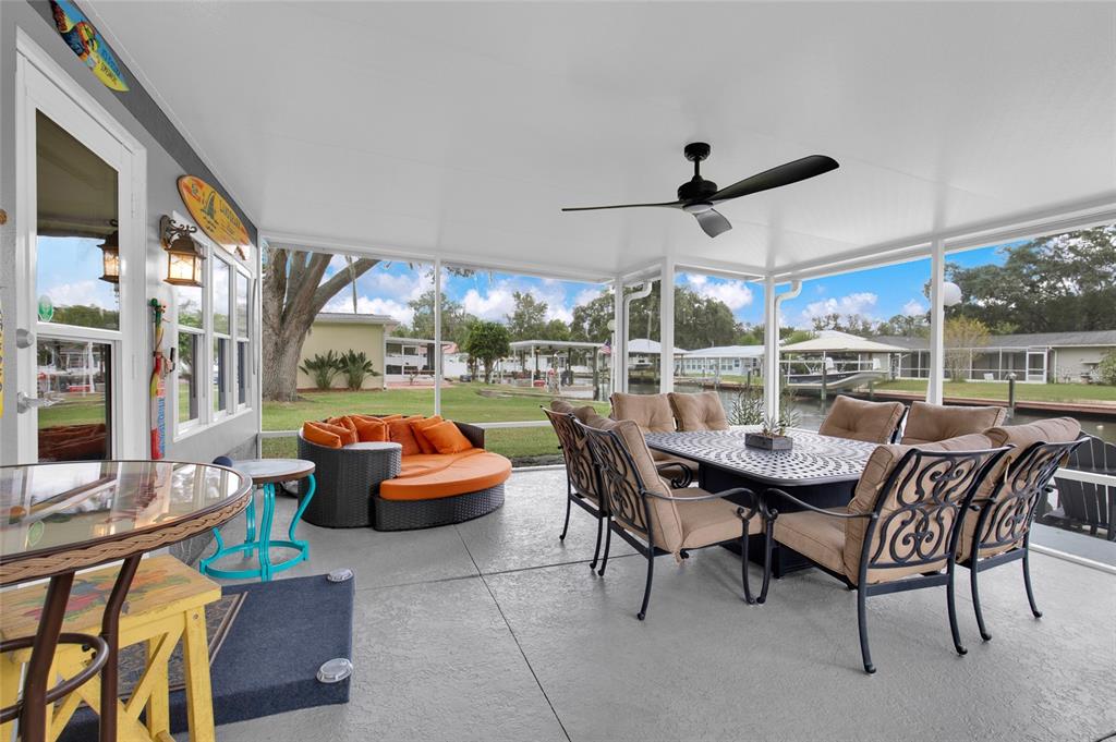 4121 South Roosevelt Point Homosassa, FL 34448 - Photo 33 of 47 a outdoor space with patio couch and wooden floor