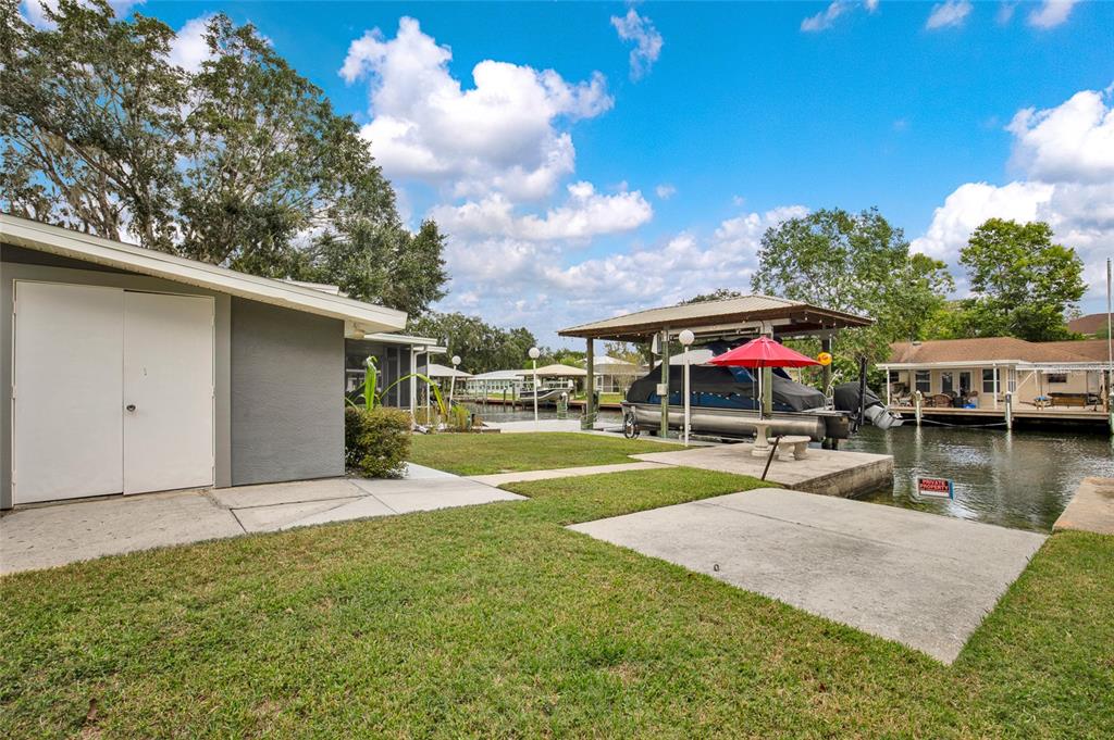 4121 South Roosevelt Point Homosassa, FL 34448 - Photo 36 of 47 a view of a house with swimming pool and sitting area