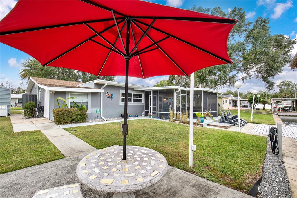 4121 South Roosevelt Point Homosassa, FL 34448 - Photo 39 of 47 a view of a house with backyard and sitting area
