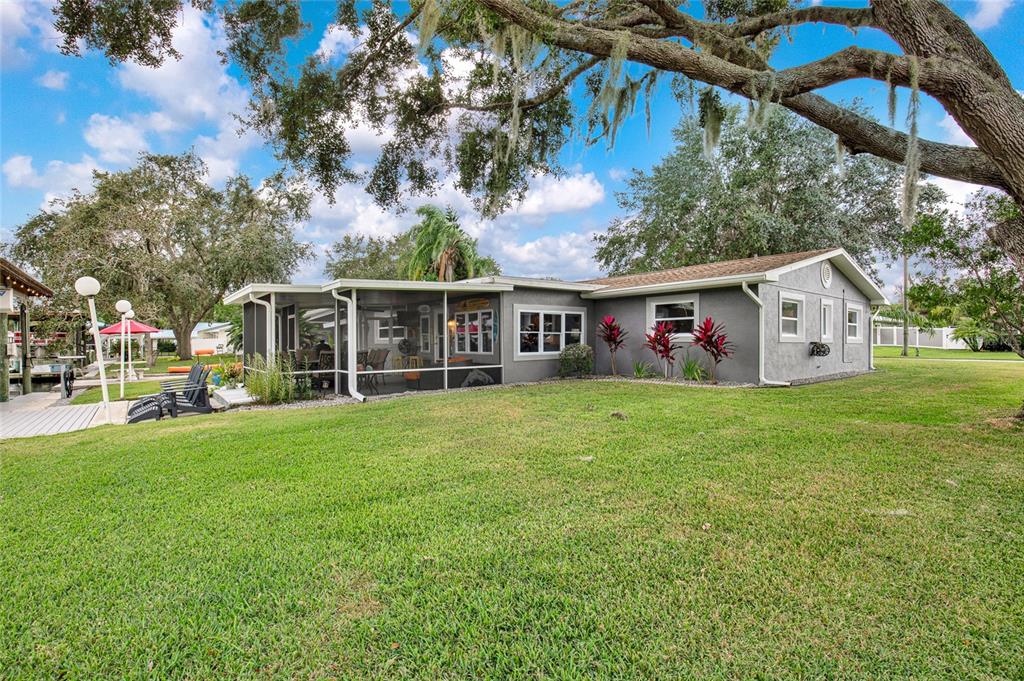 4121 South Roosevelt Point Homosassa, FL 34448 - Photo 40 of 47 a view of a house with a backyard