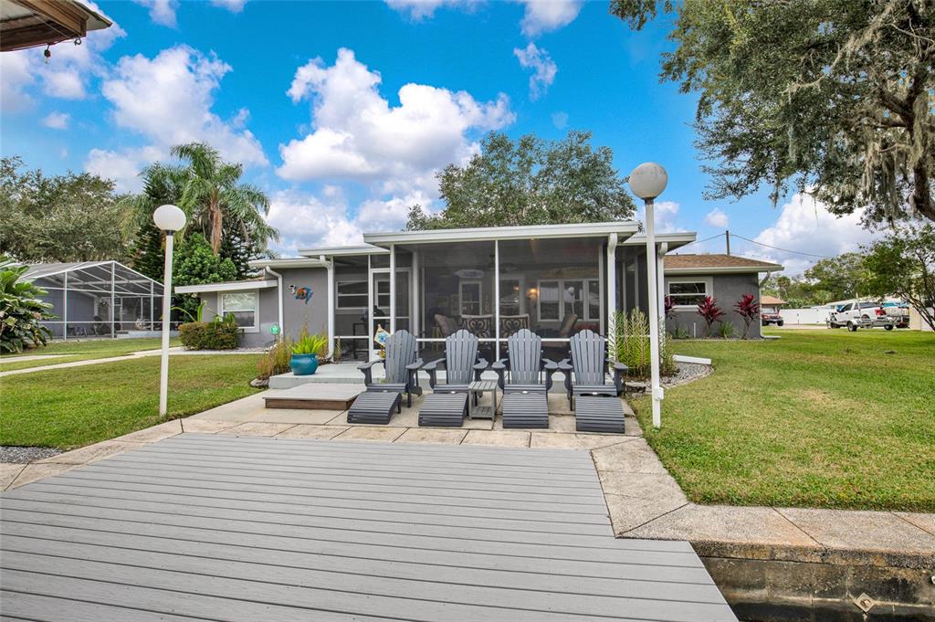 4121 South Roosevelt Point Homosassa, FL 34448 - Photo 44 of 47 a view of a house with backyard sitting area and garden
