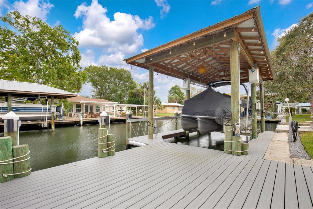4121 South Roosevelt Point Homosassa, FL 34448 - Photo 5 of 47 a view of a house with wooden deck