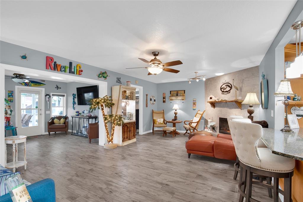 4121 South Roosevelt Point Homosassa, FL 34448 - Photo 6 of 47 a living room with furniture and a chandelier