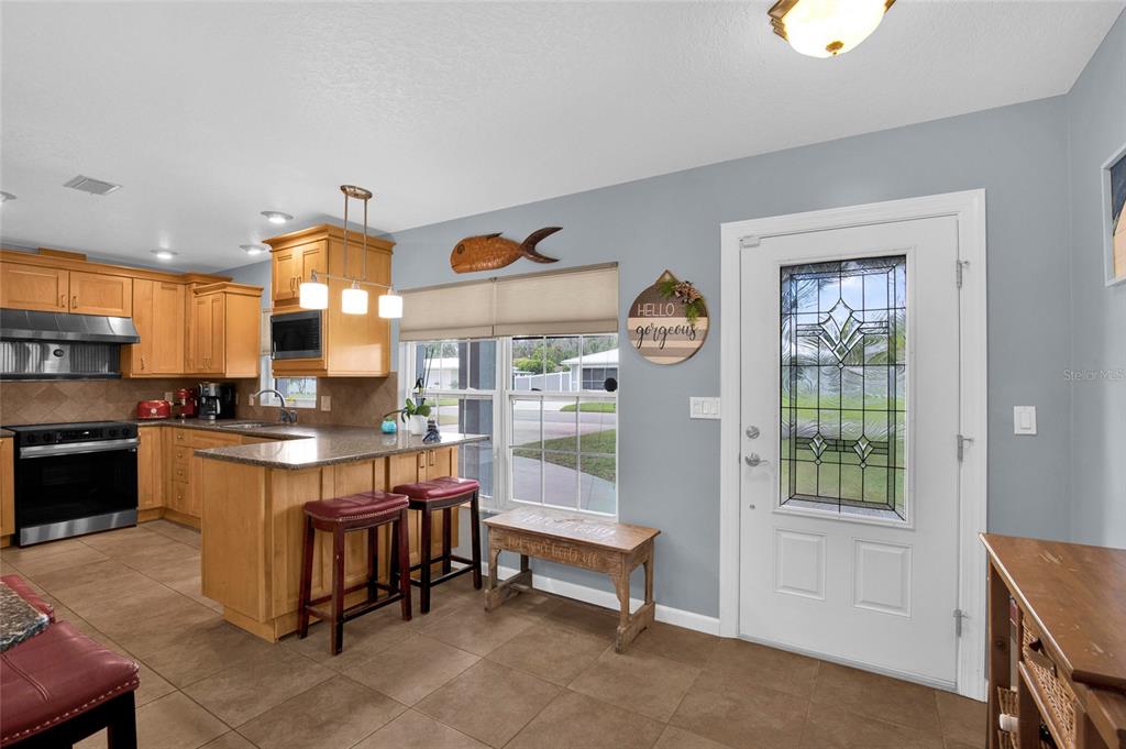 4121 South Roosevelt Point Homosassa, FL 34448 - Photo 7 of 47 a kitchen with counter top space and appliances
