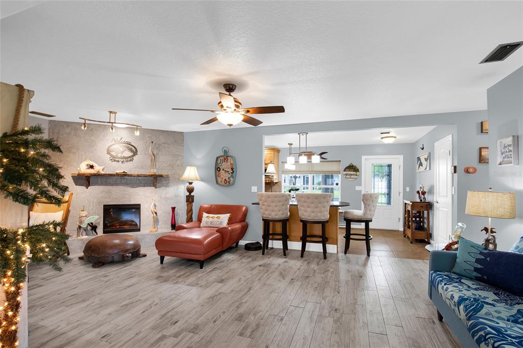 4121 South Roosevelt Point Homosassa, FL 34448 - Photo 8 of 47 a living room with furniture and a fireplace