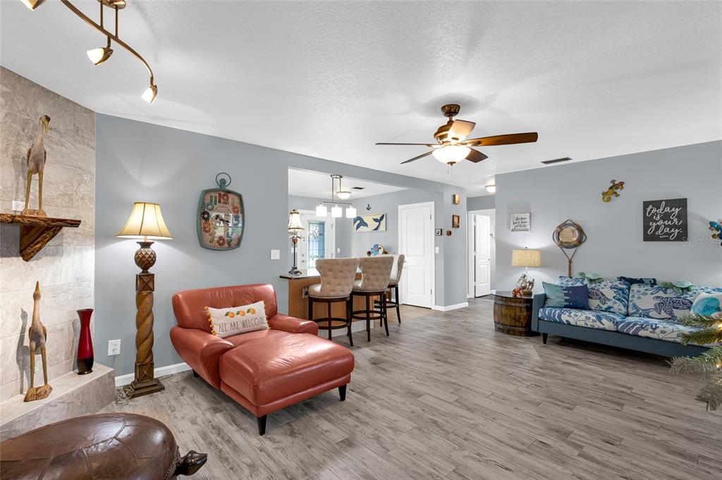 4121 South Roosevelt Point Homosassa, FL 34448 - Photo 9 of 47 a living room with furniture and wooden floor