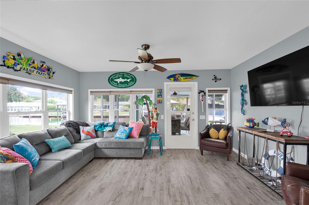 4121 South Roosevelt Point Homosassa, FL 34448 - Photo 10 of 47 a living room with furniture and a flat screen tv