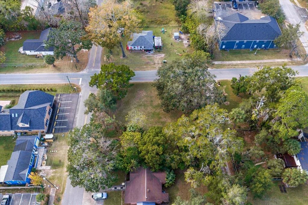 434 Southwest 14th Street, Unit A Ocala, FL 34471 - Photo 22 of 97 an aerial view of a house with a yard and lake view