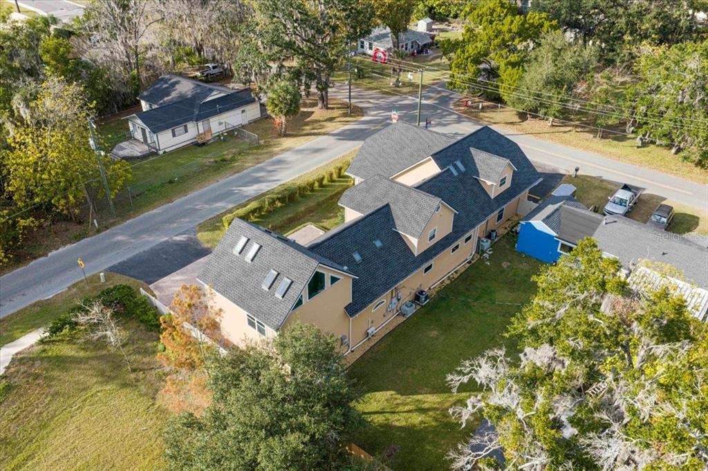 434 Southwest 14th Street, Unit A Ocala, FL 34471 - Photo 33 of 97 an aerial view of a house with a garden and swimming pool