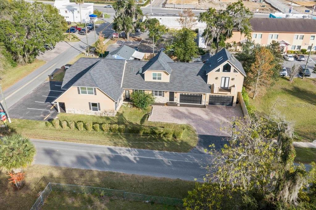 434 Southwest 14th Street, Unit A Ocala, FL 34471 - Photo 36 of 97 an aerial view of a house with a yard basket ball court and outdoor seating