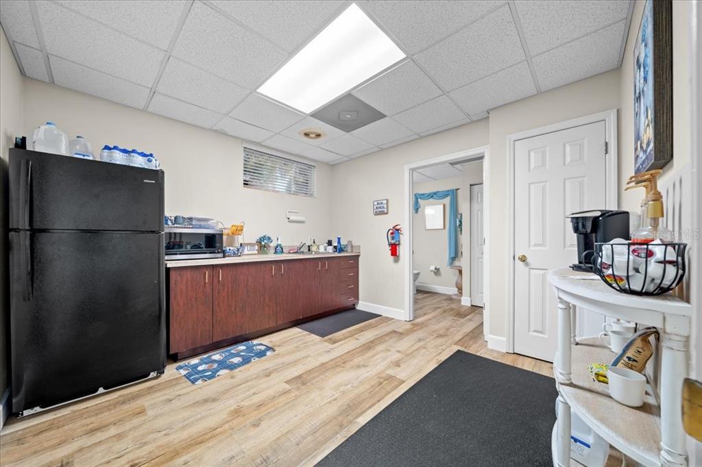 434 Southwest 14th Street, Unit A Ocala, FL 34471 - Photo 56 of 97 a kitchen with stainless steel appliances granite countertop a refrigerator and a sink