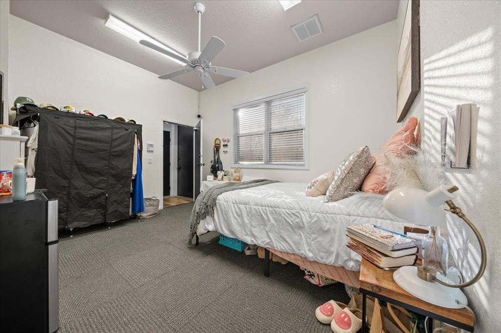 434 Southwest 14th Street, Unit A Ocala, FL 34471 - Photo 58 of 97 a spacious bedroom with a bed and a dresser