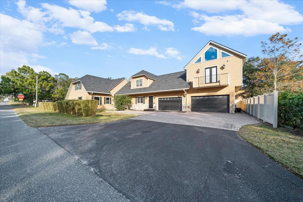 434 Southwest 14th Street, Unit A Ocala, FL 34471 - Photo 6 of 97 a view of a large white house with a big yard and large trees