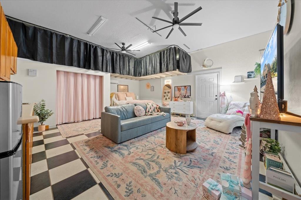 434 Southwest 14th Street, Unit A Ocala, FL 34471 - Photo 61 of 97 a living room with furniture a rug and a chandelier