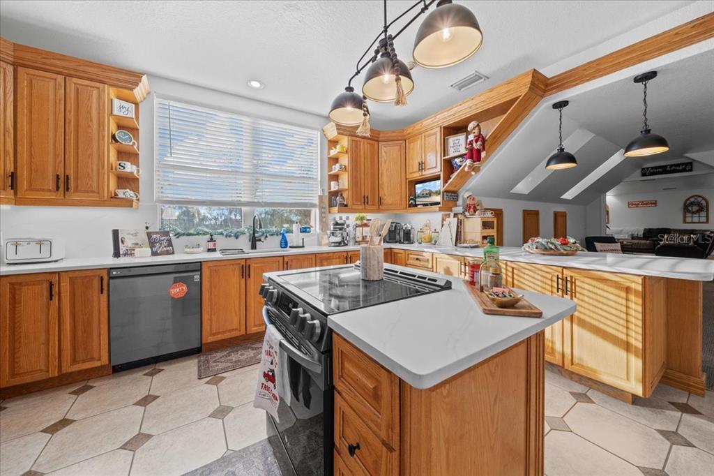 434 Southwest 14th Street, Unit A Ocala, FL 34471 - Photo 68 of 97 a kitchen with stainless steel appliances granite countertop a sink and a stove