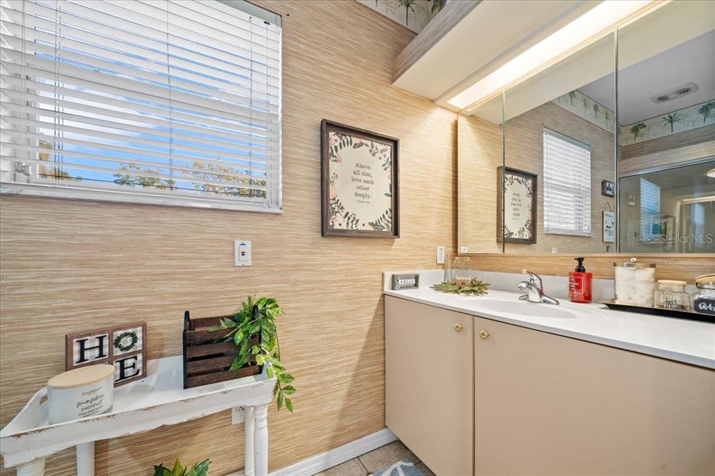 434 Southwest 14th Street, Unit A Ocala, FL 34471 - Photo 72 of 97 a bathroom with a sink and a mirror