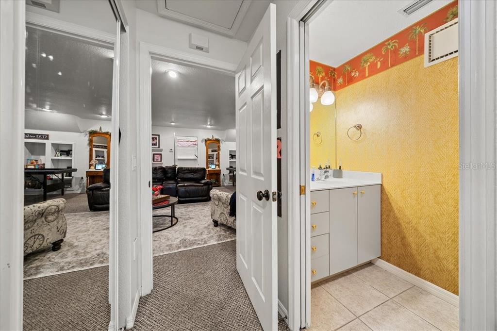 434 Southwest 14th Street, Unit A Ocala, FL 34471 - Photo 78 of 97 a view of a hallway with a livingroom and a hall with wooden floor