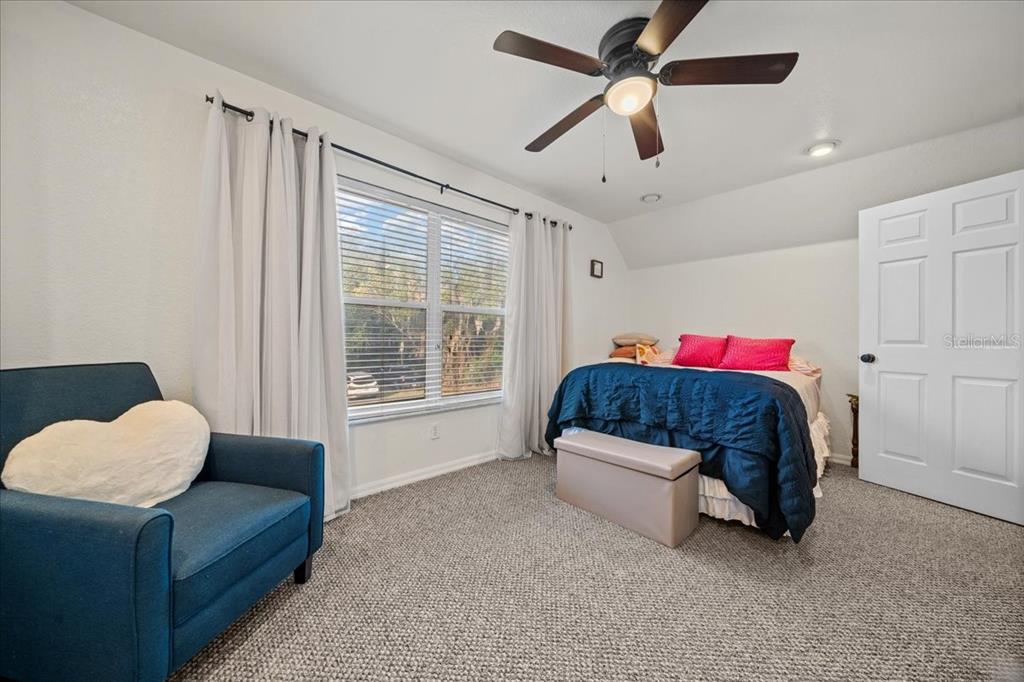 434 Southwest 14th Street, Unit A Ocala, FL 34471 - Photo 81 of 97 a bedroom with a bed and a couch