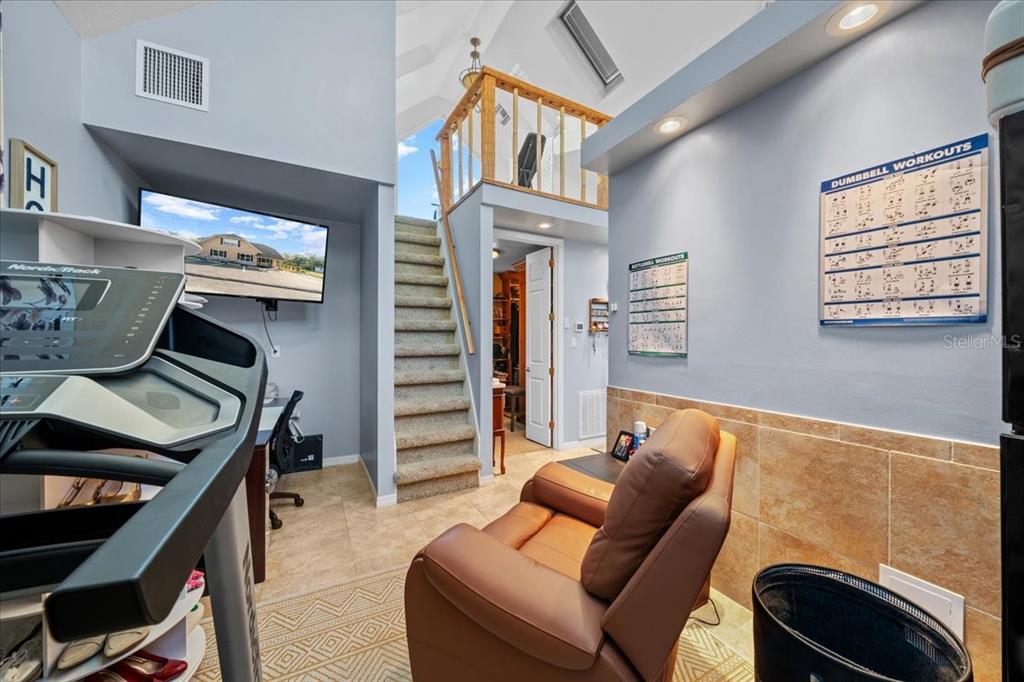 434 Southwest 14th Street, Unit A Ocala, FL 34471 - Photo 97 of 97 a living room with furniture a flat screen tv and closet