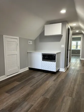 a kitchen with a stove a sink and a refrigerator