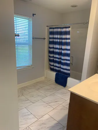 a view of walk in closet and bedroom